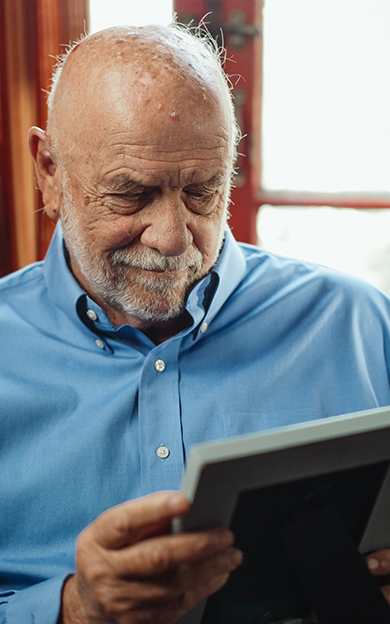 resident looking at old photos