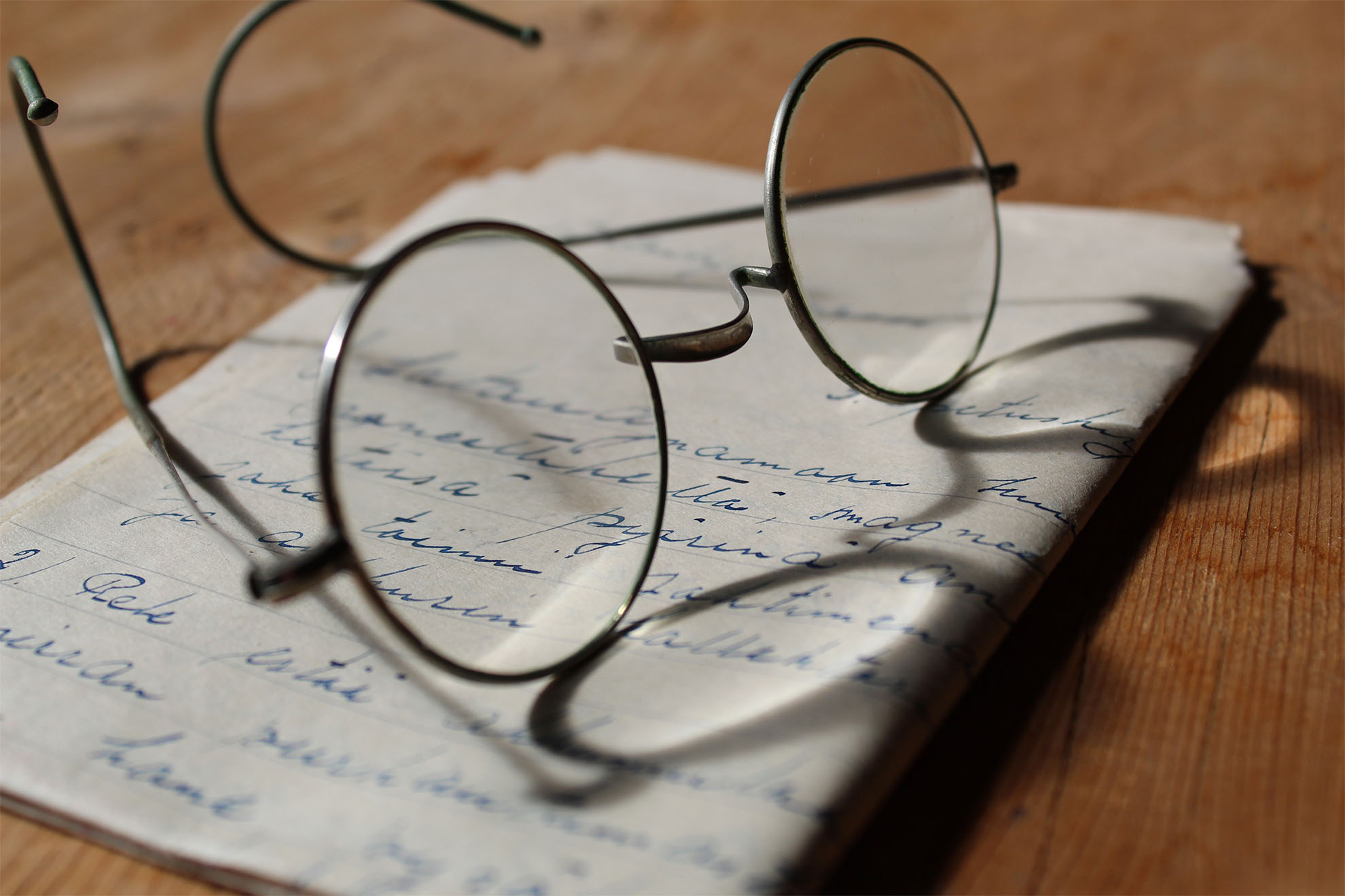 round glasses and book