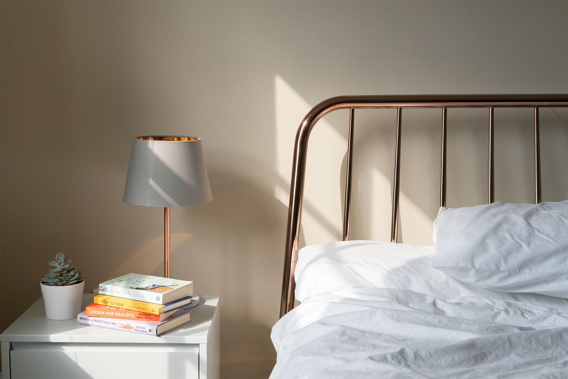 bed with a bedside table